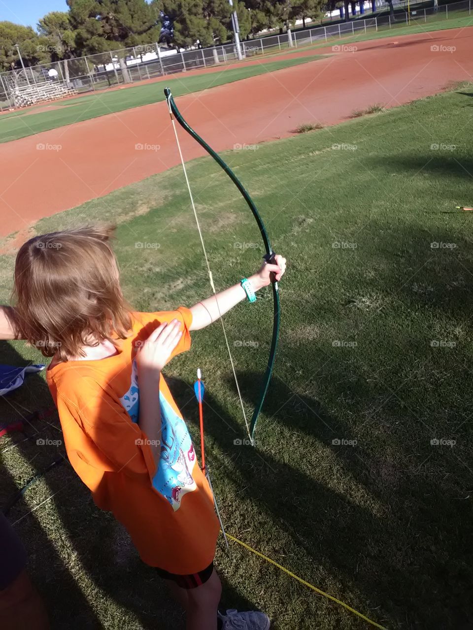 my daughter at day camp for Cub scouts yeah. she learn how to shoot safely with the bow and arrow.