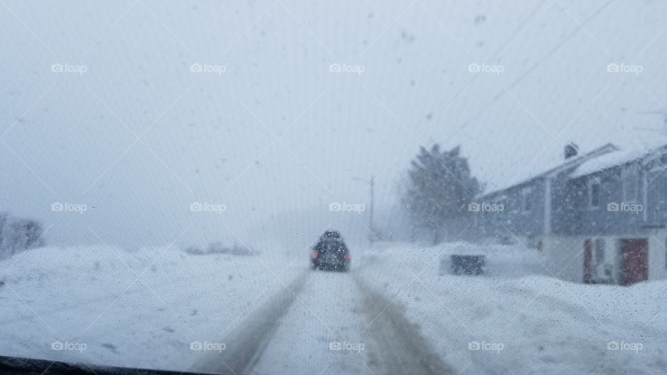 Driving in the snow blizzard