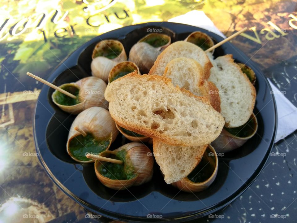 Close-up of stuffed snails with bread