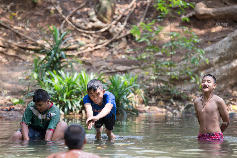 Young boy playing in the water