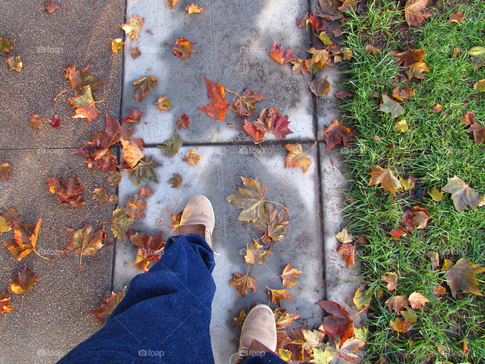 boots leaves and concrete