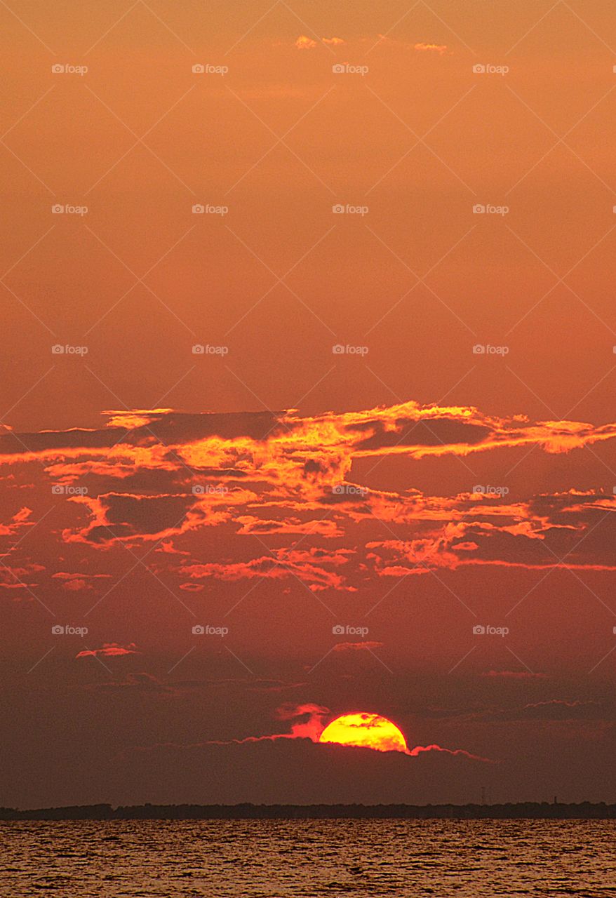 Brilliant streaks of yellow, orange, gold, blue, pink and red overcome the blue and purple of the sky. The sky resembled a prism; all the colors blended perfectly together. It's as if the colors and intensity of the light is just right. 