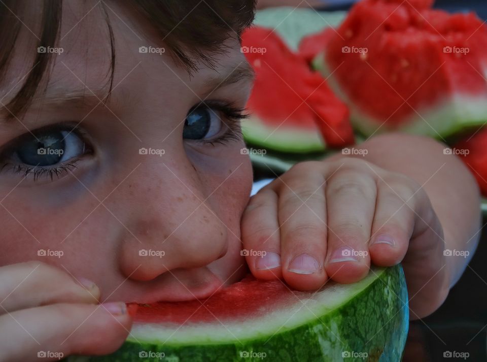 Boy Eating Watermelon. Young Boy Eating Juicy Fresh Watermelon