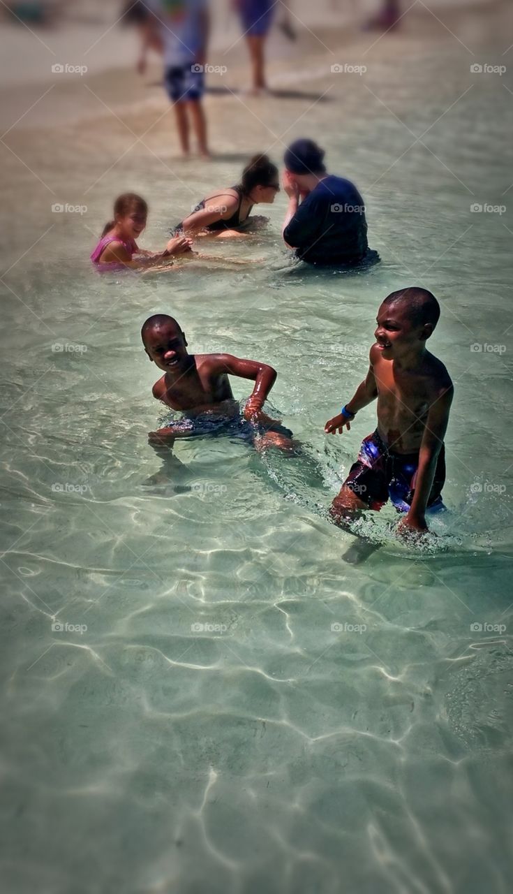 Two little adorable Bahamian boys enjoying a day at the Beach.. Nassau Bahama's