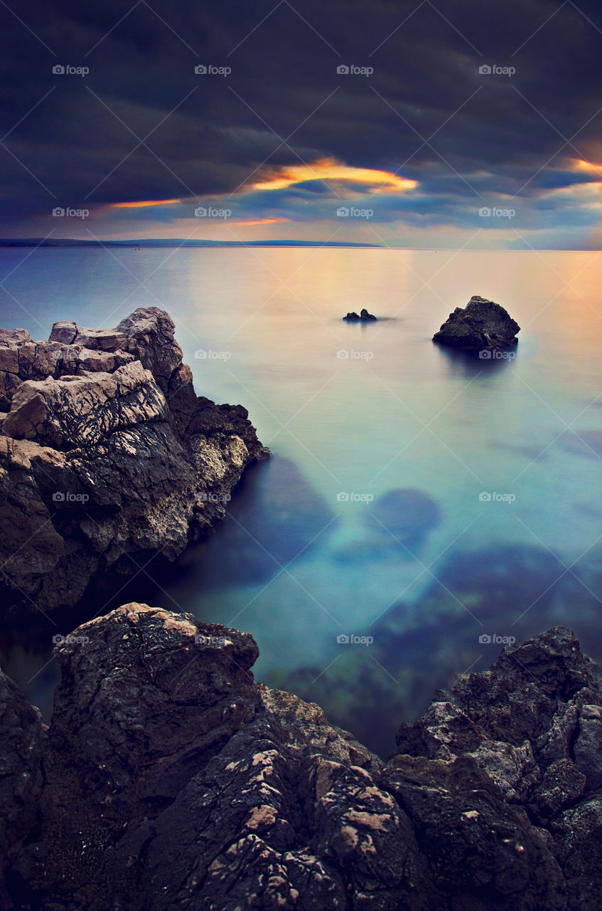 Dramatic sky reflecting in sea