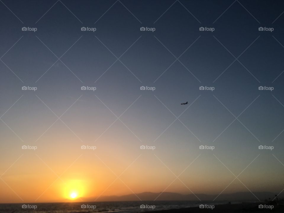 Sunset with departing Aircraft