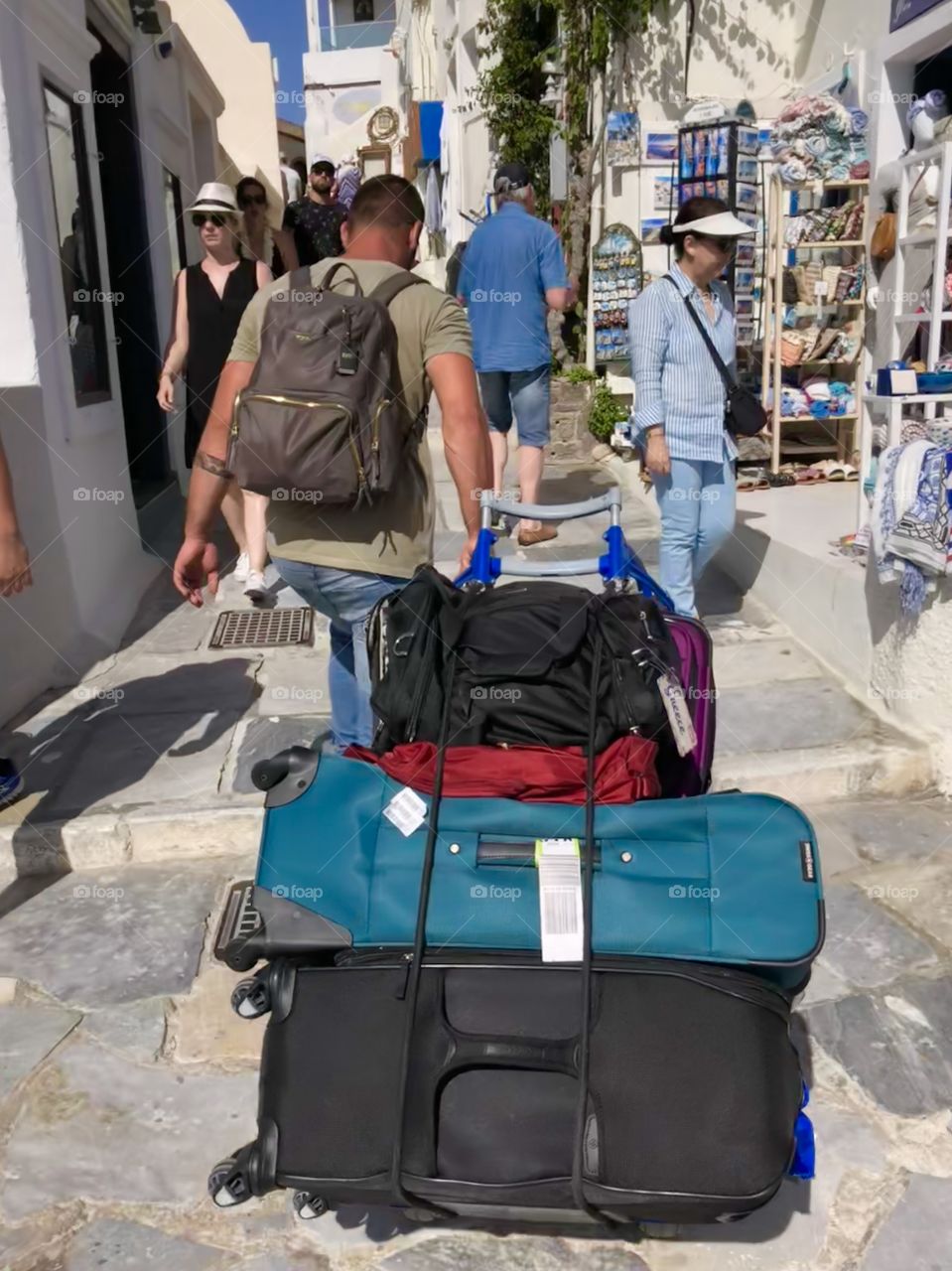 There are no roads in Santorini meaning you have a currier carrying suitcases to your AirBnb. 