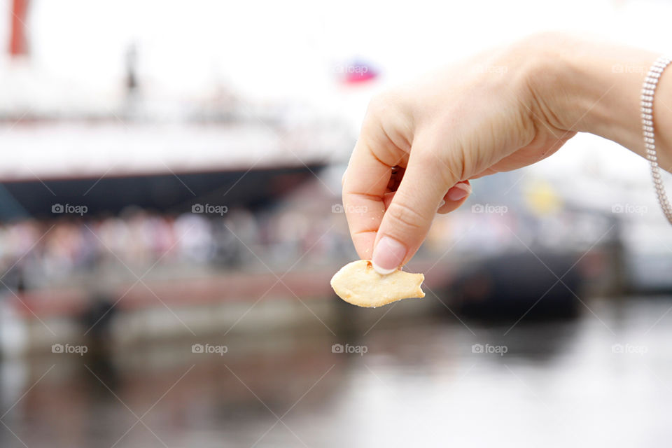 Fish cracker in hand