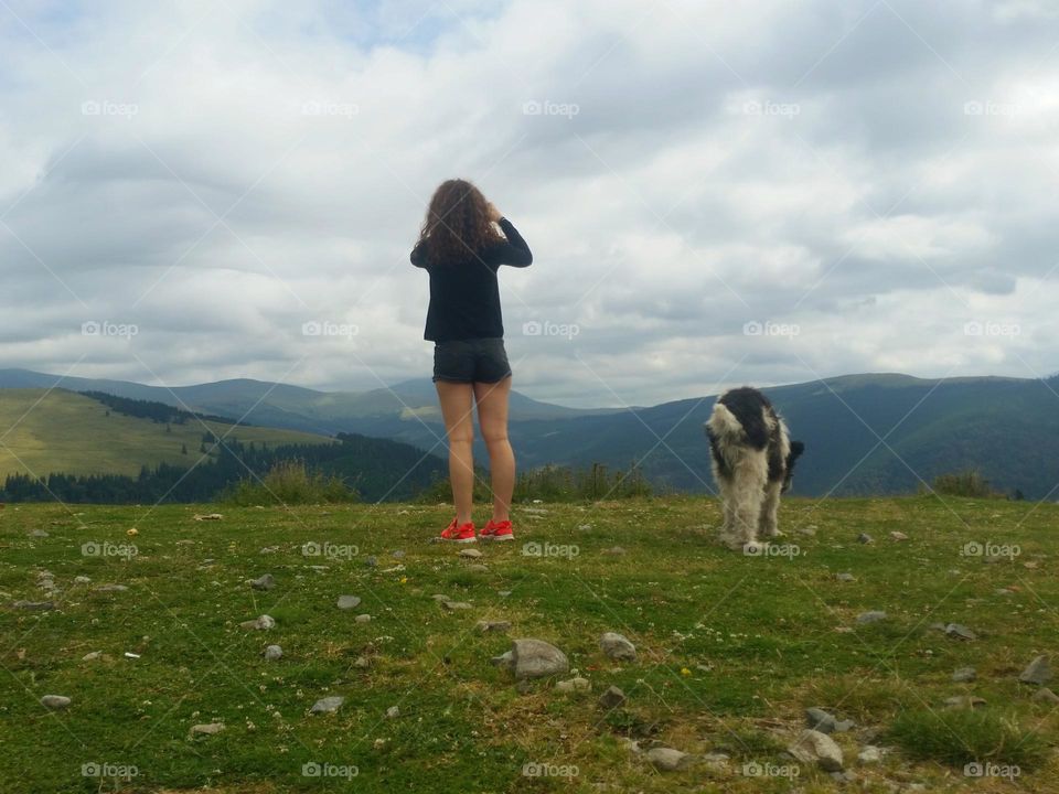 the young girl and the dog above the world