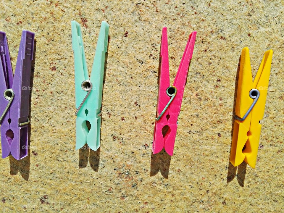 colorful clips on stone background