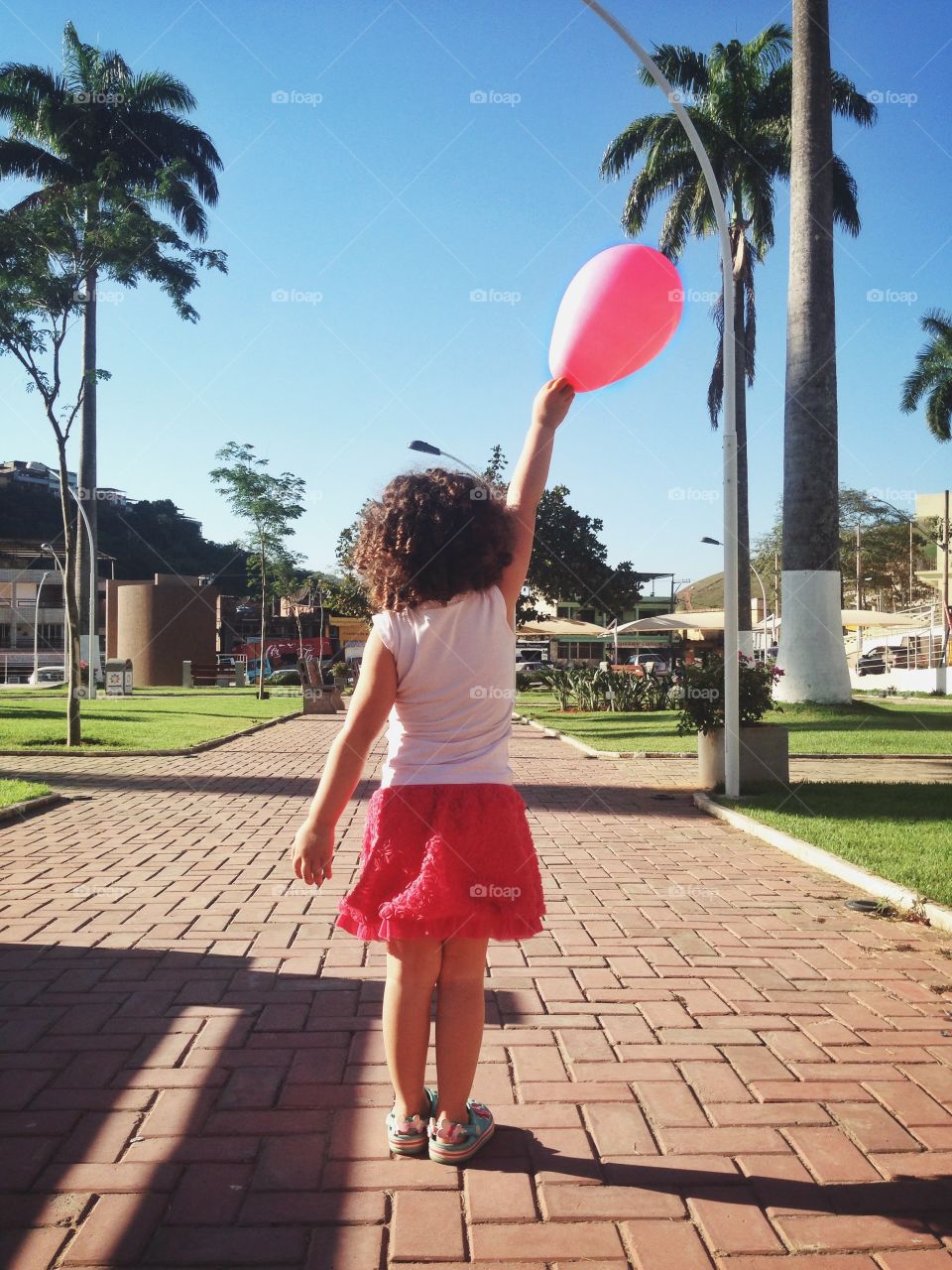 She is a little girl who are enjoying a gorgeous sunny day 