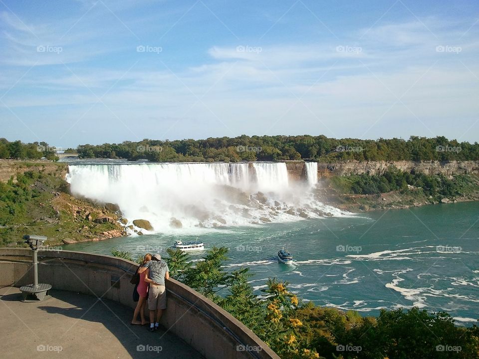 The Falls. Couple enjoying Niagara Falls on the Canada Side