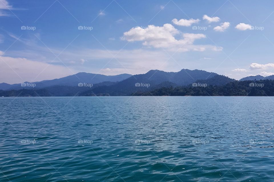 Scenic view of lake against mountian range