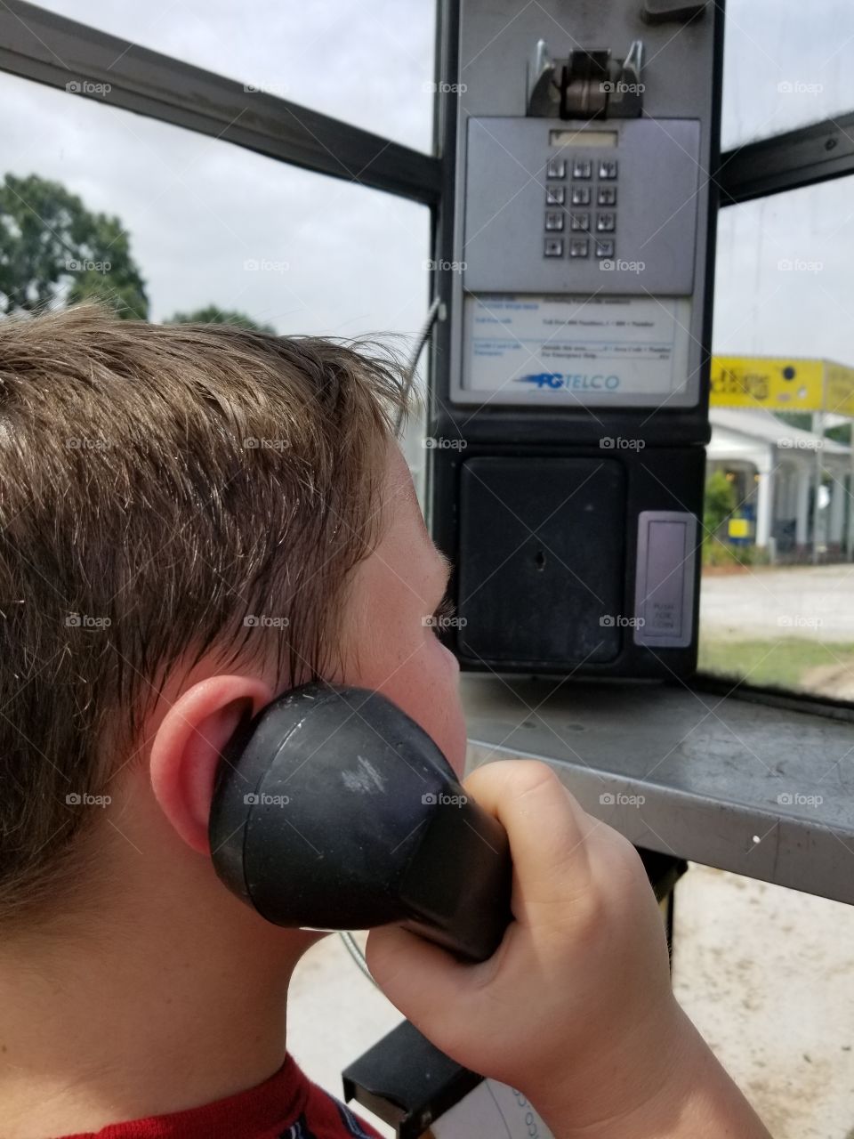 Superman Making a Call From the Phone Booth