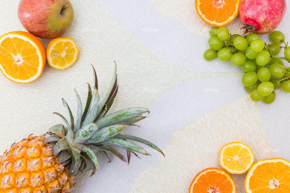 Fresh delicious summer food and colors. Fresh fruit flat lay on a textured background. Vibrant juicy and healthy.