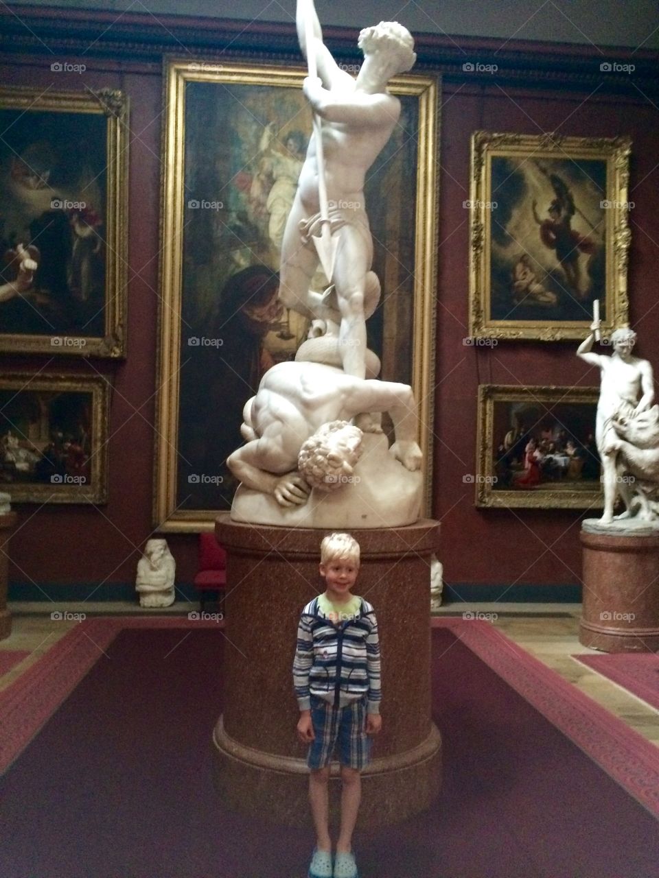 Boy standing in museum