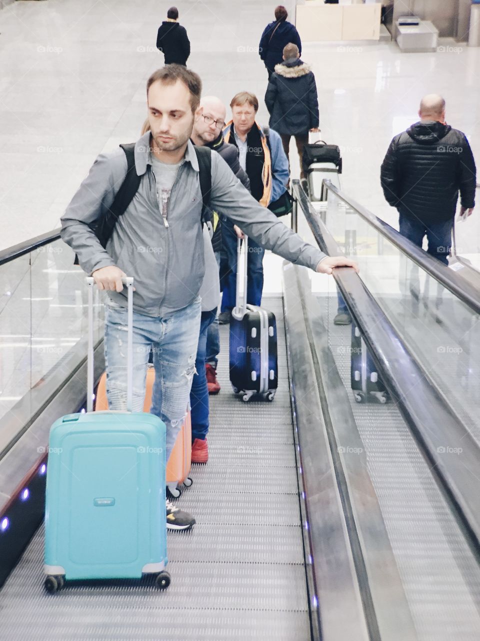 A man with a luggage in the airport