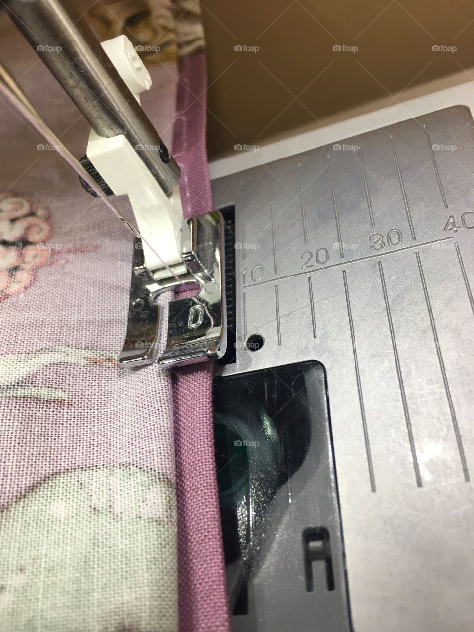 Close-Up sewing a hem on a purple skirt 