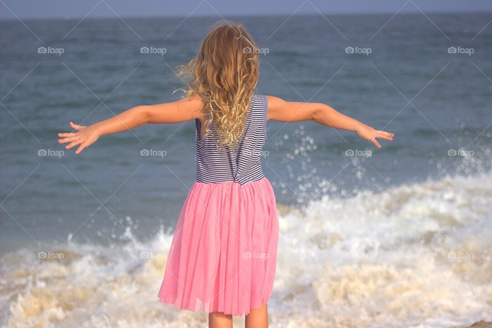 FREEDOM for this beautiful little girl at the beach!