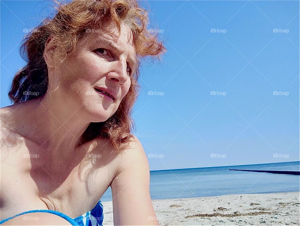 Bathing in the “Ostsee”, the “Baltic Sea” is a delight on a hot summer’s day and so is sunbathing afterwards on the sandy beach of the island “Hiddensee” in “Mecklenburg - Western Pomerania”, Germany. 2024. Hypnotic Productions