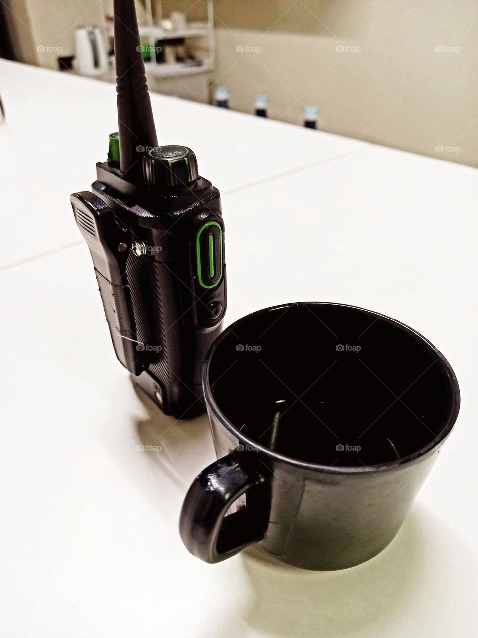 A cup of coffee and a communication tool