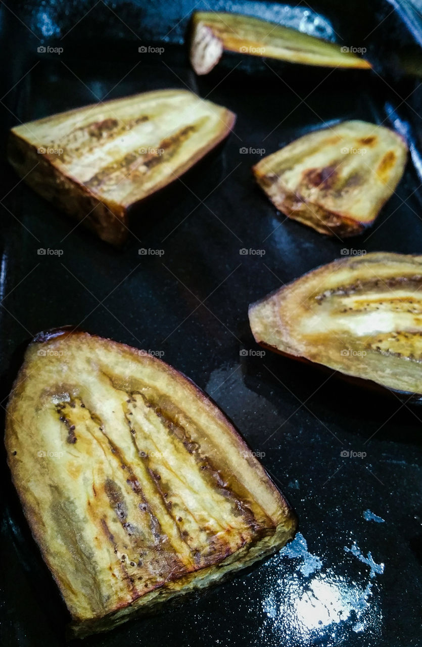 Roasting Aubergines / Eggplants in a baking tray