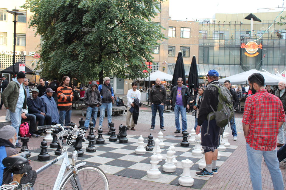 A very intense game of giant chess! Amsterdam locals take their chess very seriously 