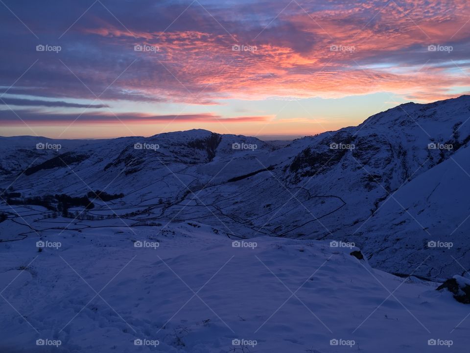 Dramatic sky over snowy mountain