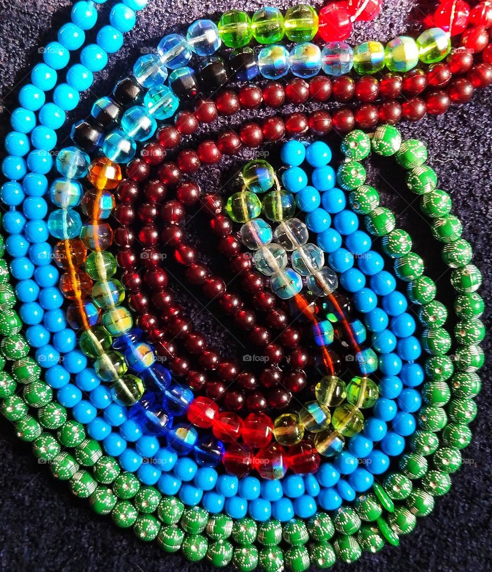 Embrace of colors, the prayer beads became excited.Blue of hope,green of life,red of love and gold of light,hand in hand have woven a story of a thousand wishes.Here,each bead is a piece of my dreams with smile and pure intentions that leads to peace