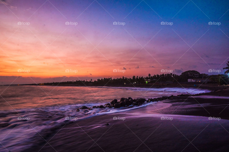 Sunset on a pier on the beaches of the Caribbean