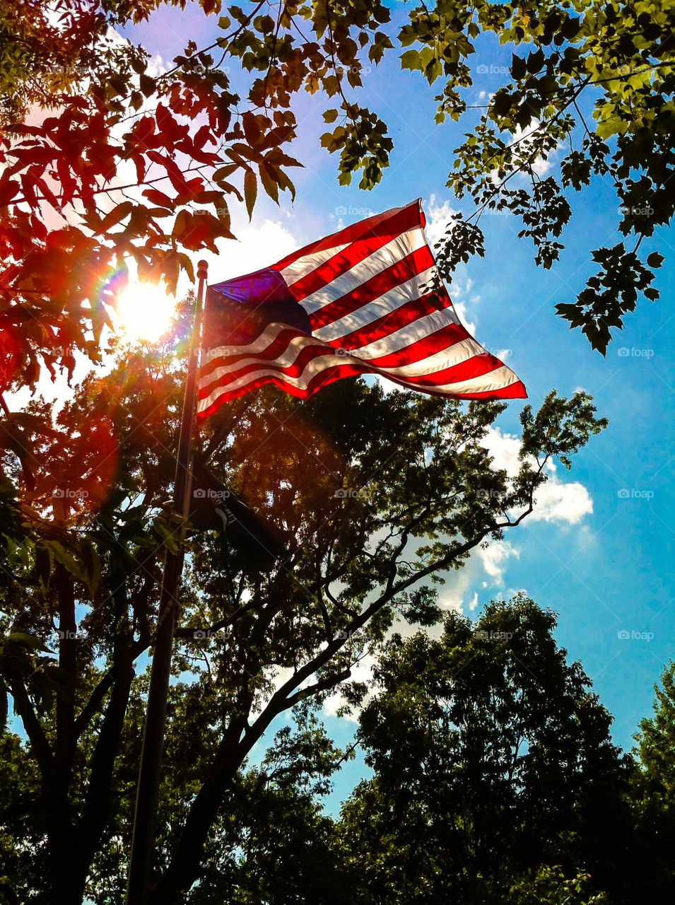 A flag flies high above the Vietnam Veterans Memorial in Washington, DC