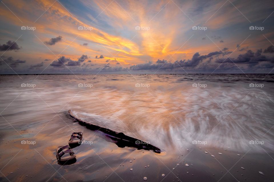 Flip Flops floating in the Sunset