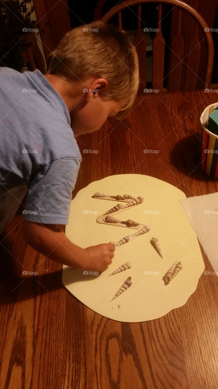Boy making crafts
