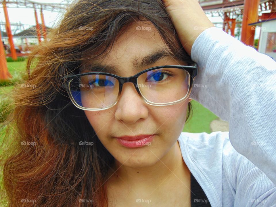 close up picture of a girl wearing glasses