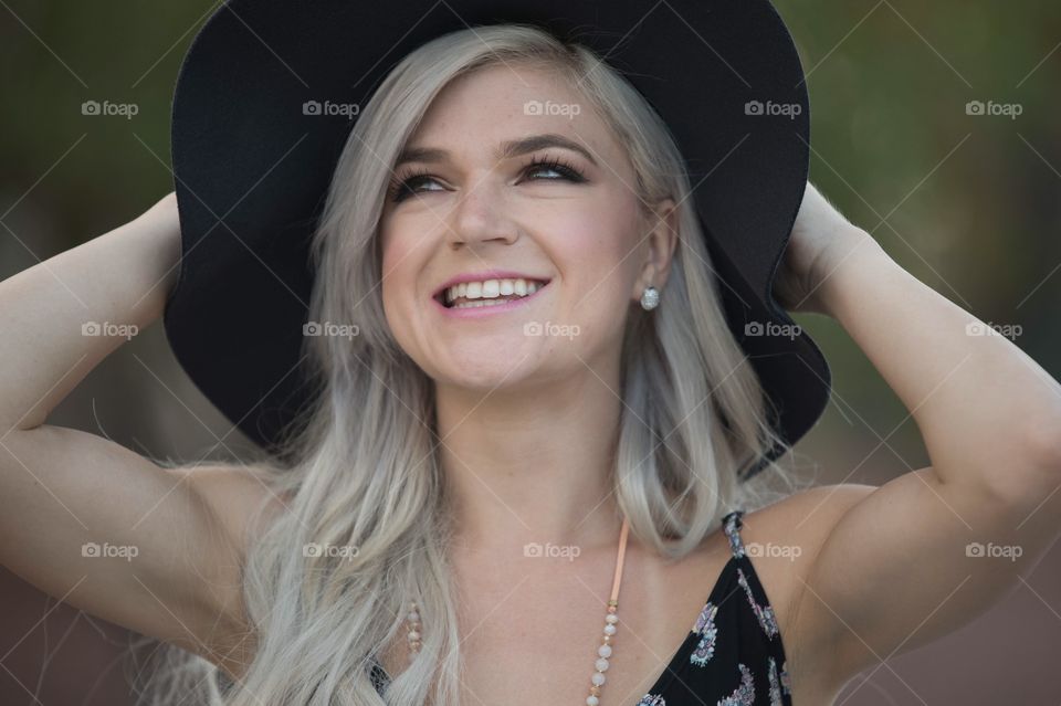 Girl happy smiling headshot black hat