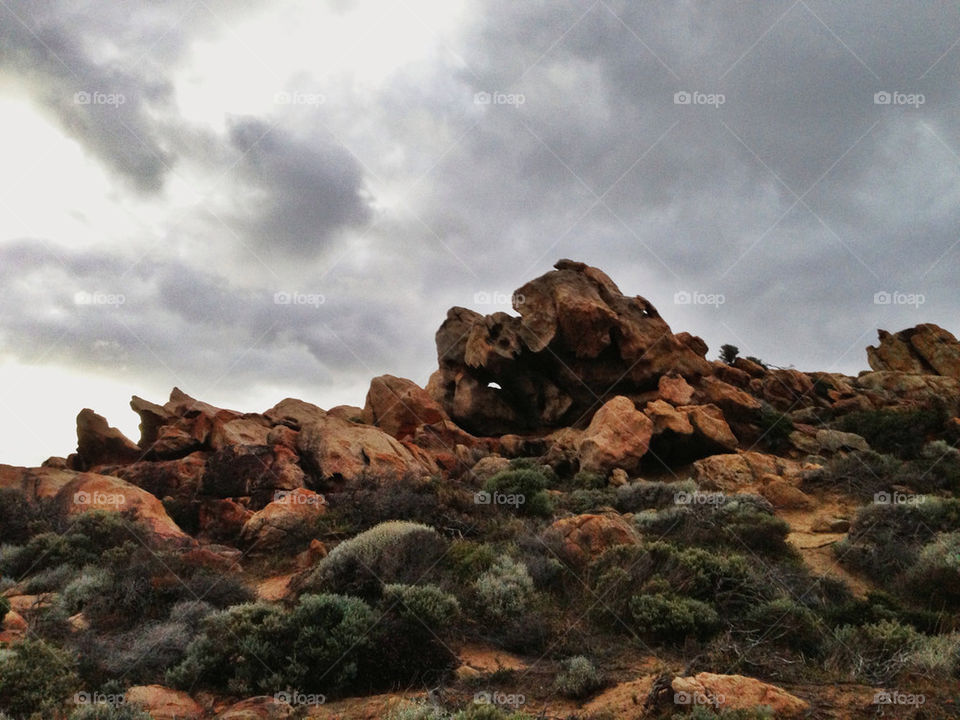 Red rocks and stormy sky