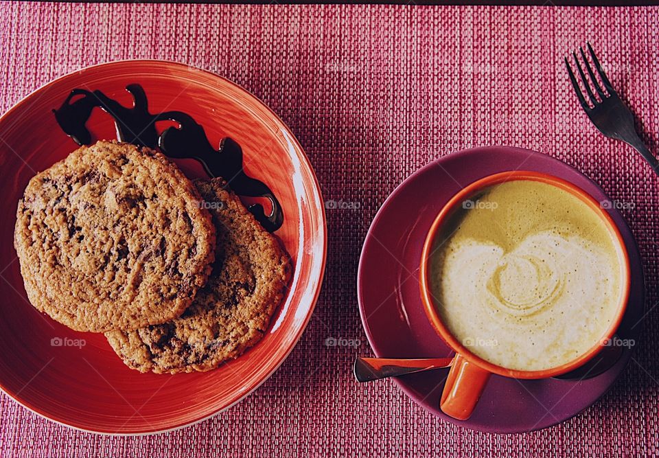 Chocolate chip cookies paired with a matcha latte.