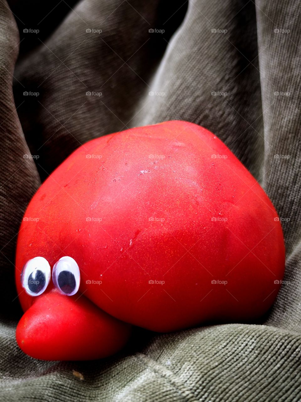 wonders of nature.  Tomato with a nose.  Humor