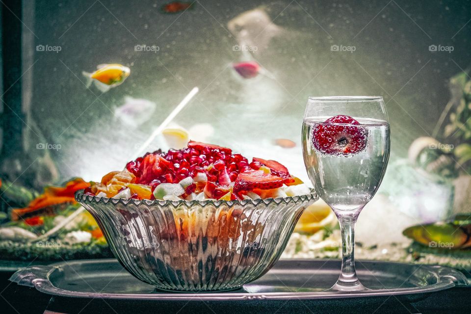 A fruit salad and the aqua-mineral water