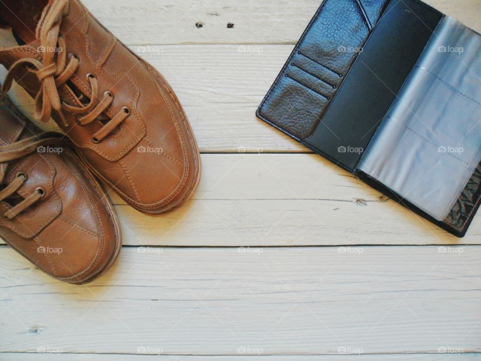 Brown leather men's shoes and notebook