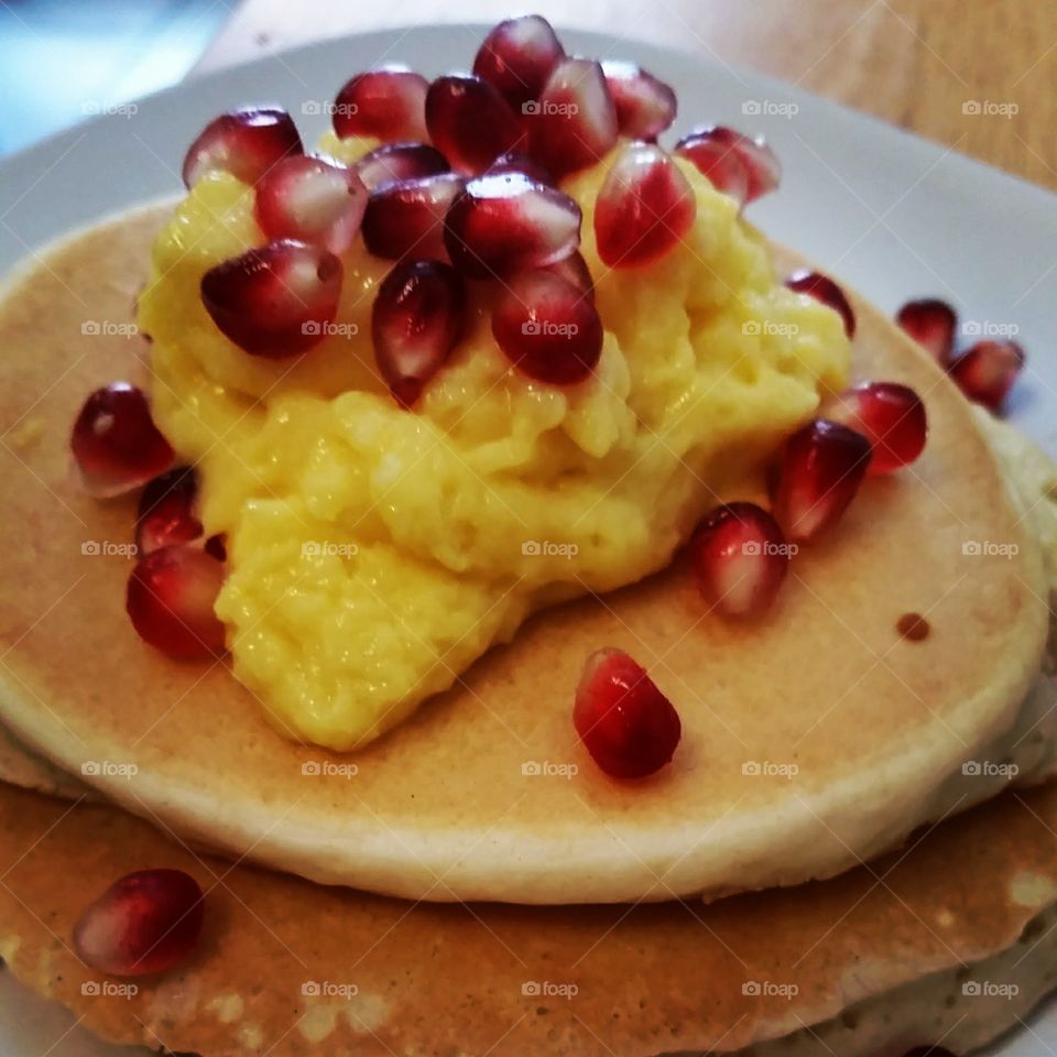 pancakes with lemon curd and pomegranate seeds
