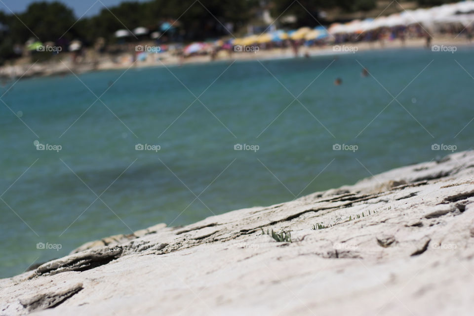 rocky beach. rocks with beach in the background