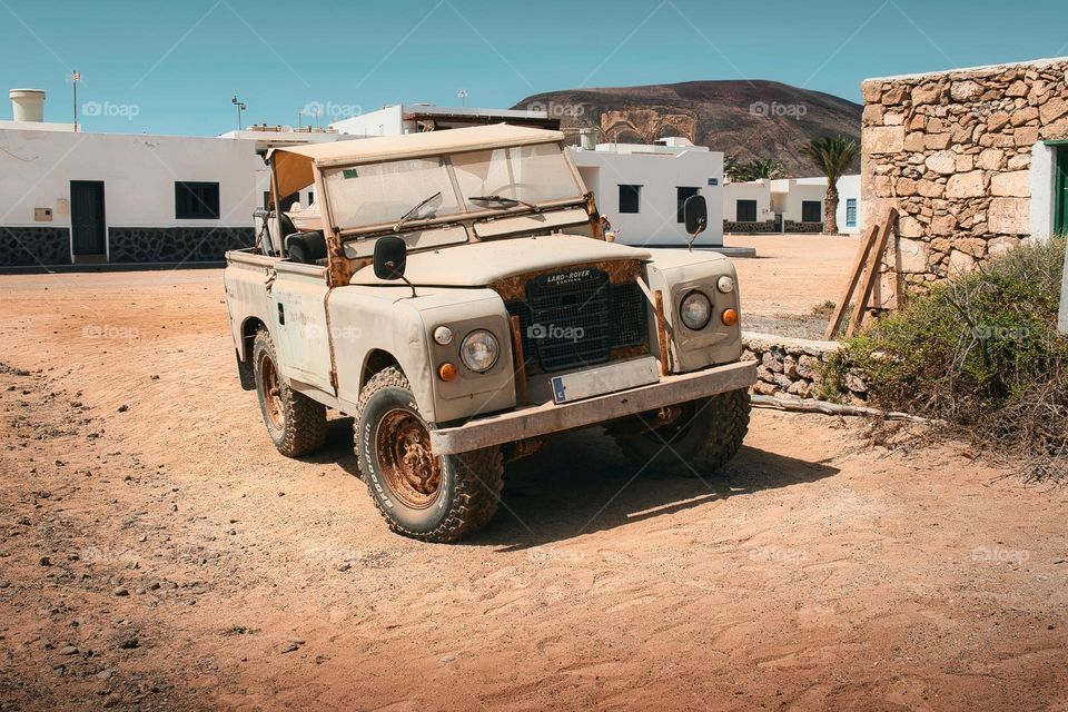 Old rusty off road vehicle at Caleta del Sebo, La Graciosa, Canary Islands