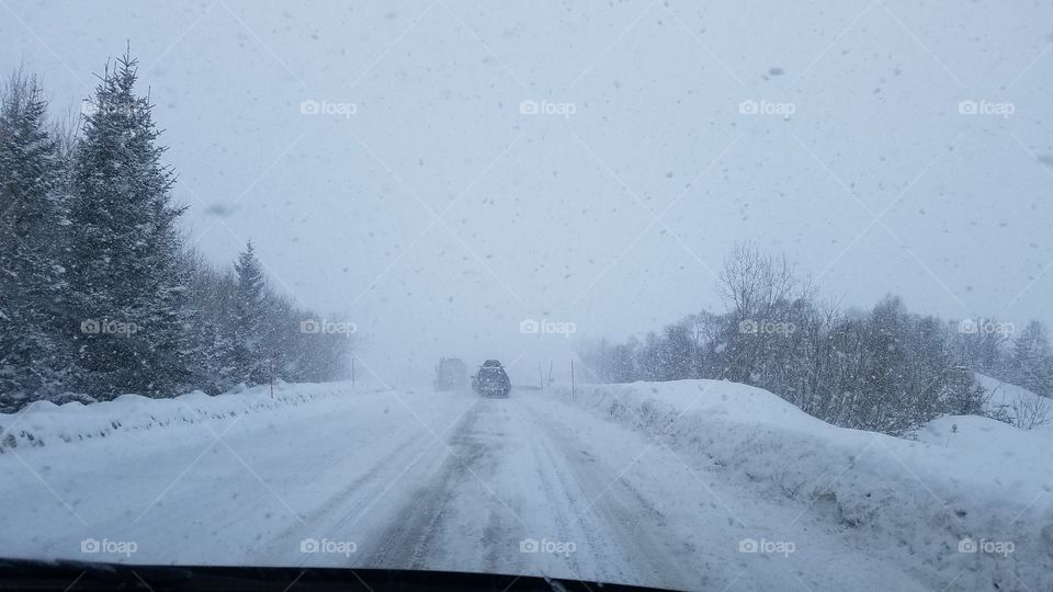 Driving in the snow blizzard