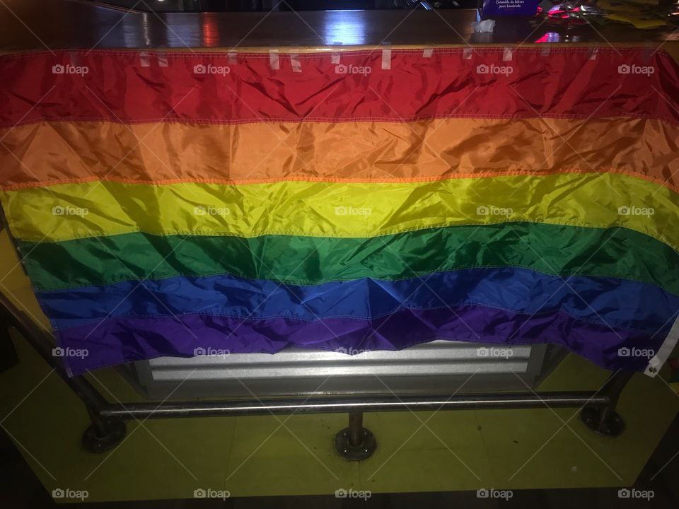 Photo of the Rainbow pride flag, which represents the LGBTQIA2S* community as a whole. It has become a symbol for the New civil/human rights movements since the 1960’s and beyond to 2018. A rallying cry for all those who cry out for justice 