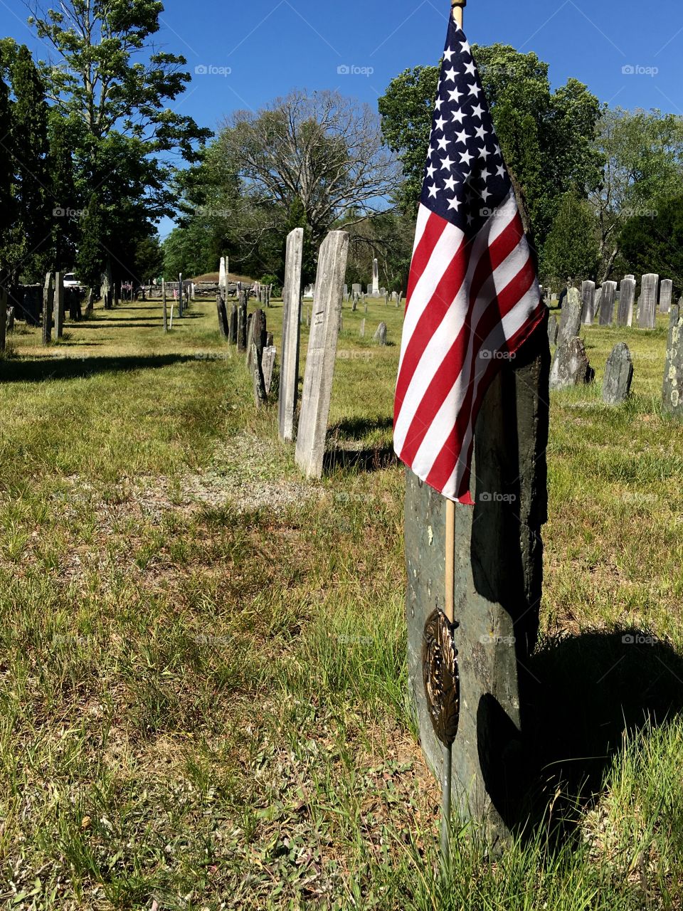 Civil War gravestones lined up with an American 🇺🇸Flag marking just 1 of the many.