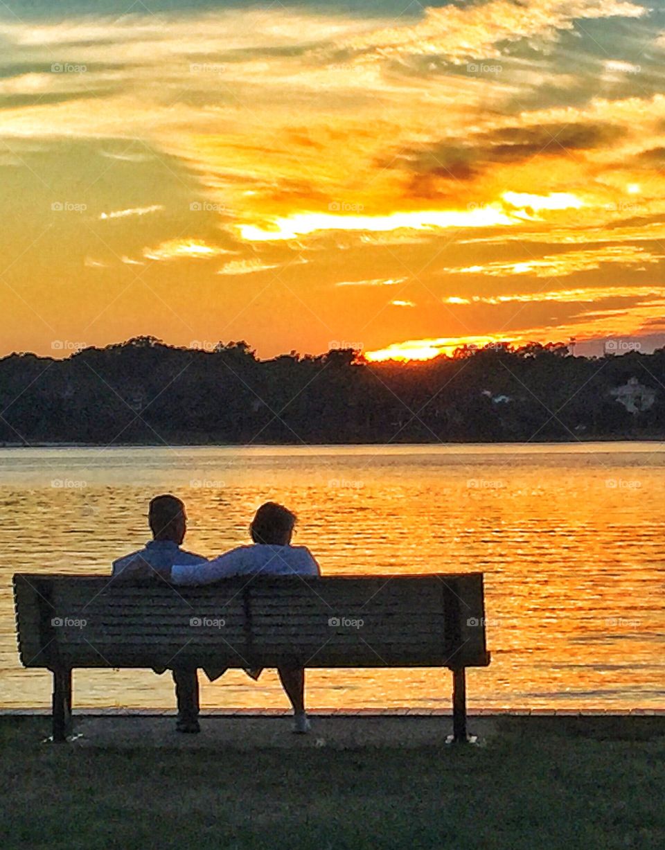 Sernior couple admiring sunset