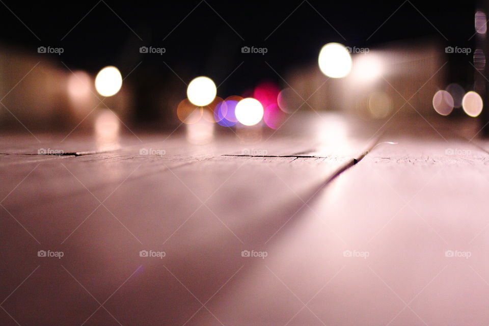 Bokeh lights on wooden planks