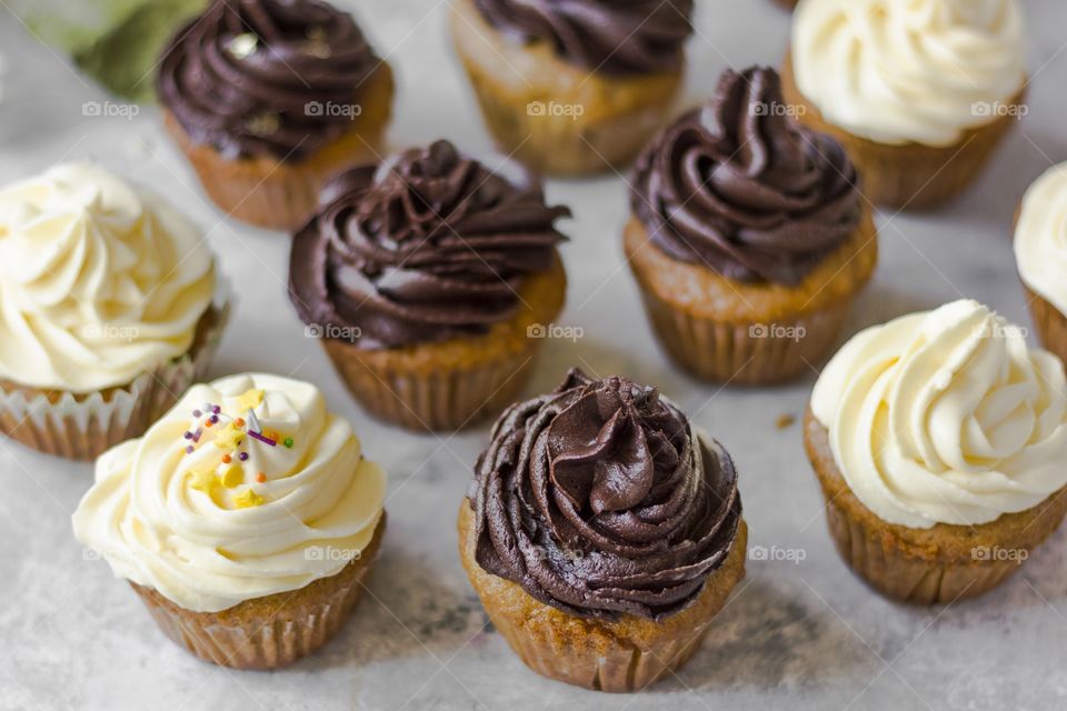 cupcakes with white and dark chocolate frosting