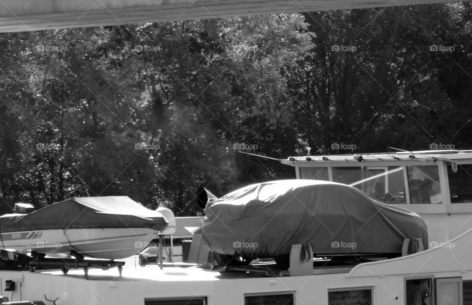 Various vehicles heavy transportation on boat roof